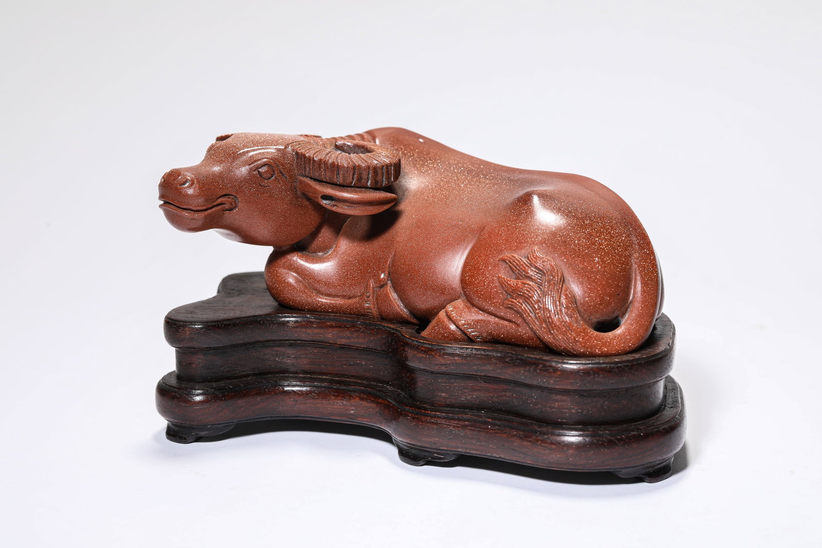 A GOLDSTONE CARVED BUFFALO: A GOLDSTONE CARVED BUFFALO Dimensions: Length: 13.8 cm (5.43 in.), Width: 6.6 cm (2.60 in.), Height: 4.7 cm (1.85 in.). All measurements are approximate.