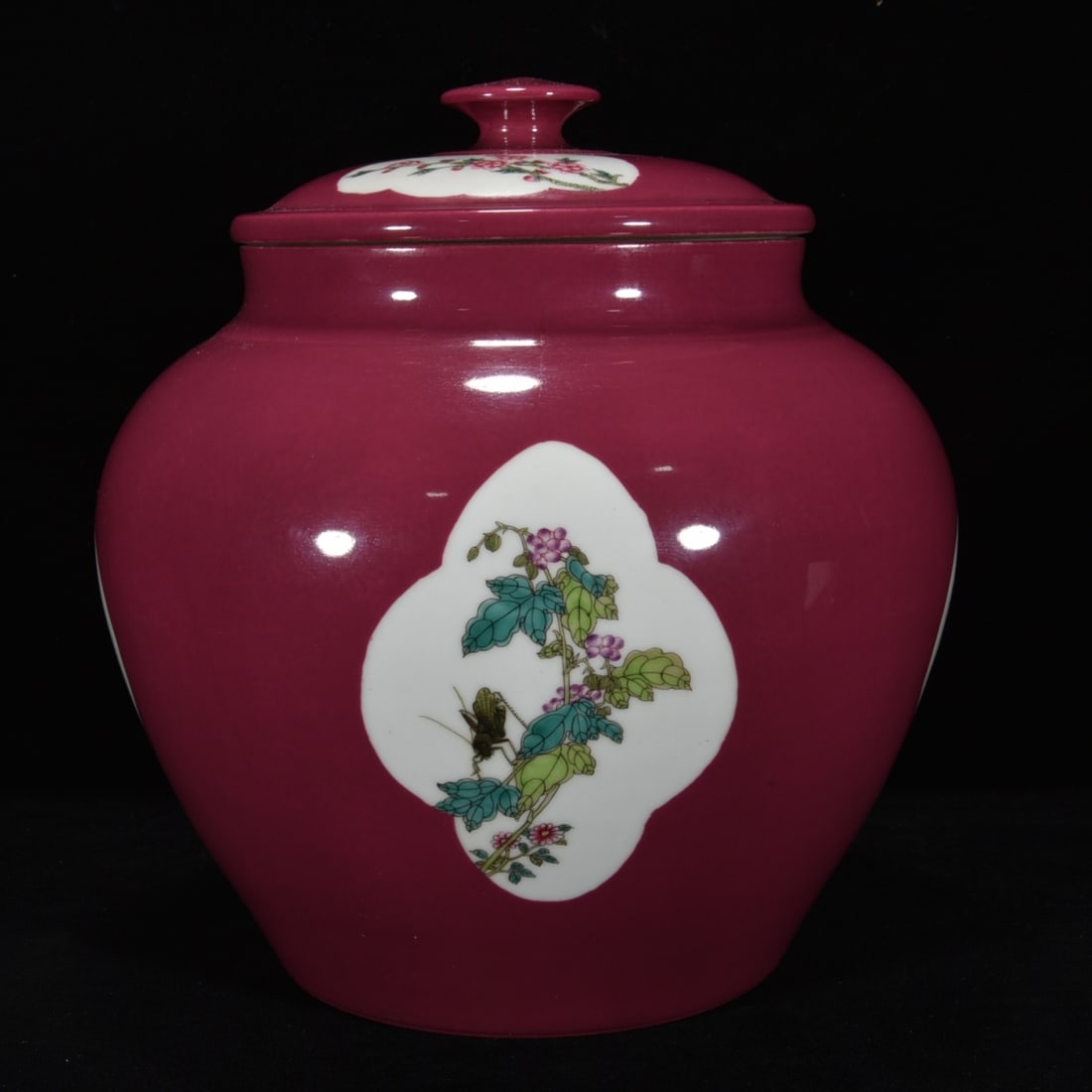A RUBY RED-GLAZED 'FLOWERS' COVERED JAR: A RUBY RED-GLAZED 'FLOWERS' COVERED JAR Dimensions: Length: 26 cm (10.24 in.), Width: 24 cm (9.45 in.). All measurements are approximate.