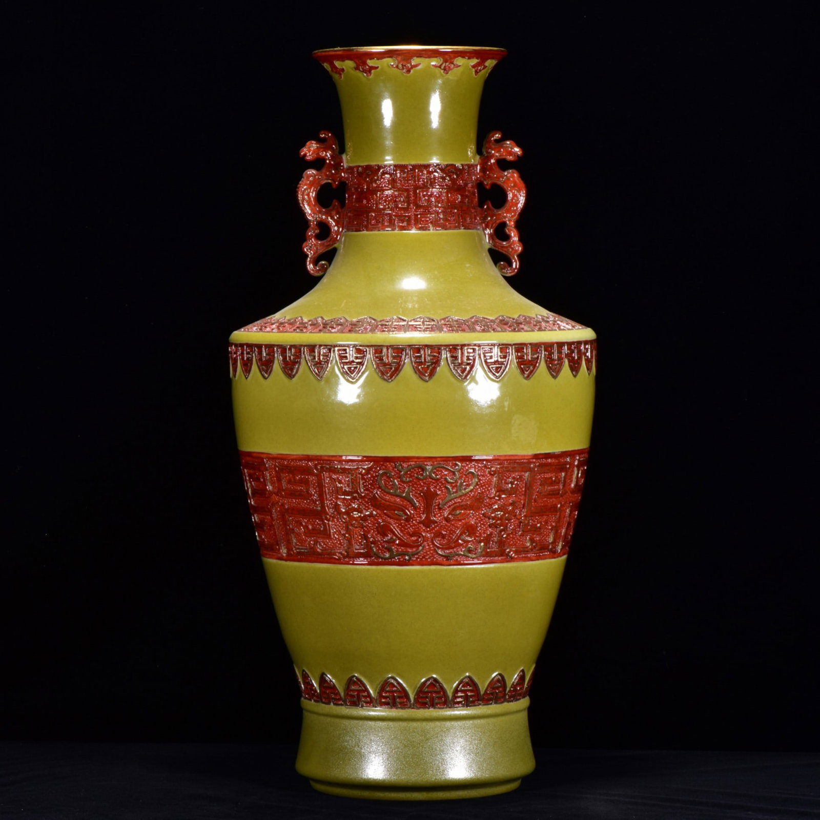 A TEA-DUST GLAZED CARVED 'DRAGON' GILT DECORATED DOUBLE-HANDLE VASE: A TEA-DUST GLAZED CARVED 'DRAGON' GILT DECORATED DOUBLE-HANDLE VASE Dimensions: Length: 48 cm (18.90 in.), Width: 24 cm (9.45 in.). All measurements are approximate.