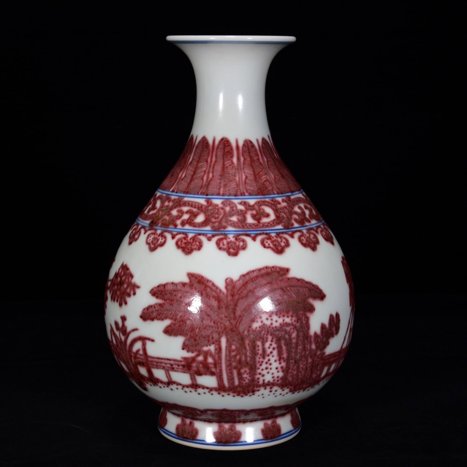A UNDERGLAZED RED 'BANANA' YUHUCHUNPING: A UNDERGLAZED RED 'BANANA' YUHUCHUNPING Dimensions: Length: 21 cm (8.27 in.), Width: 13 cm (5.12 in.). All measurements are approximate.
