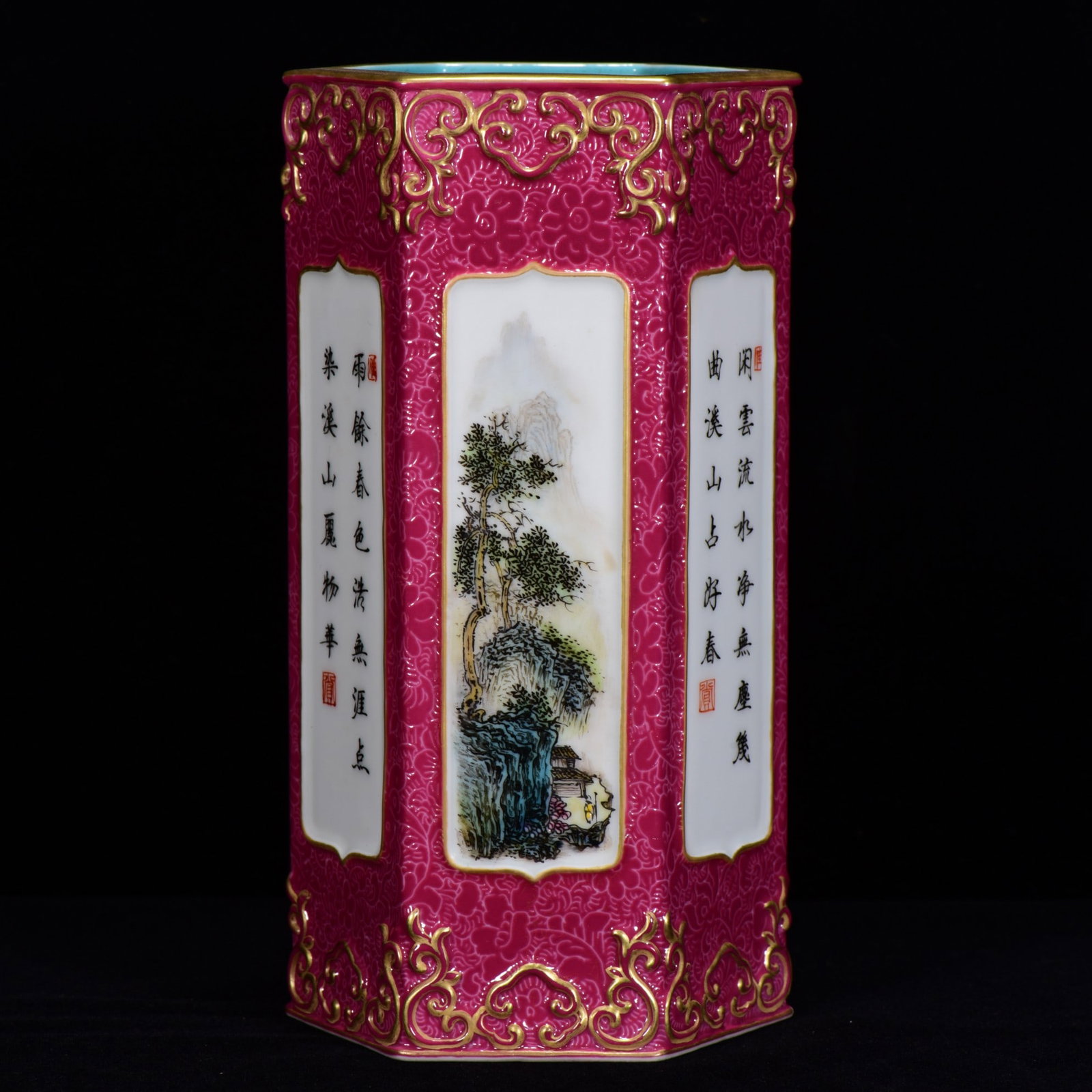 A RUBY RED-GROUND FAMILLE ROSE 'LANDSCAPE AND CHARACTERS' HEXAGONAL GILT DECORATED BRUSH POT: A RUBY RED-GROUND FAMILLE ROSE 'LANDSCAPE AND CHARACTERS' HEXAGONAL GILT DECORATED BRUSH POT Dimensions: Length: 17 cm (6.69 in.), Width: 8 cm (3.15 in.). All measurements are approximate.