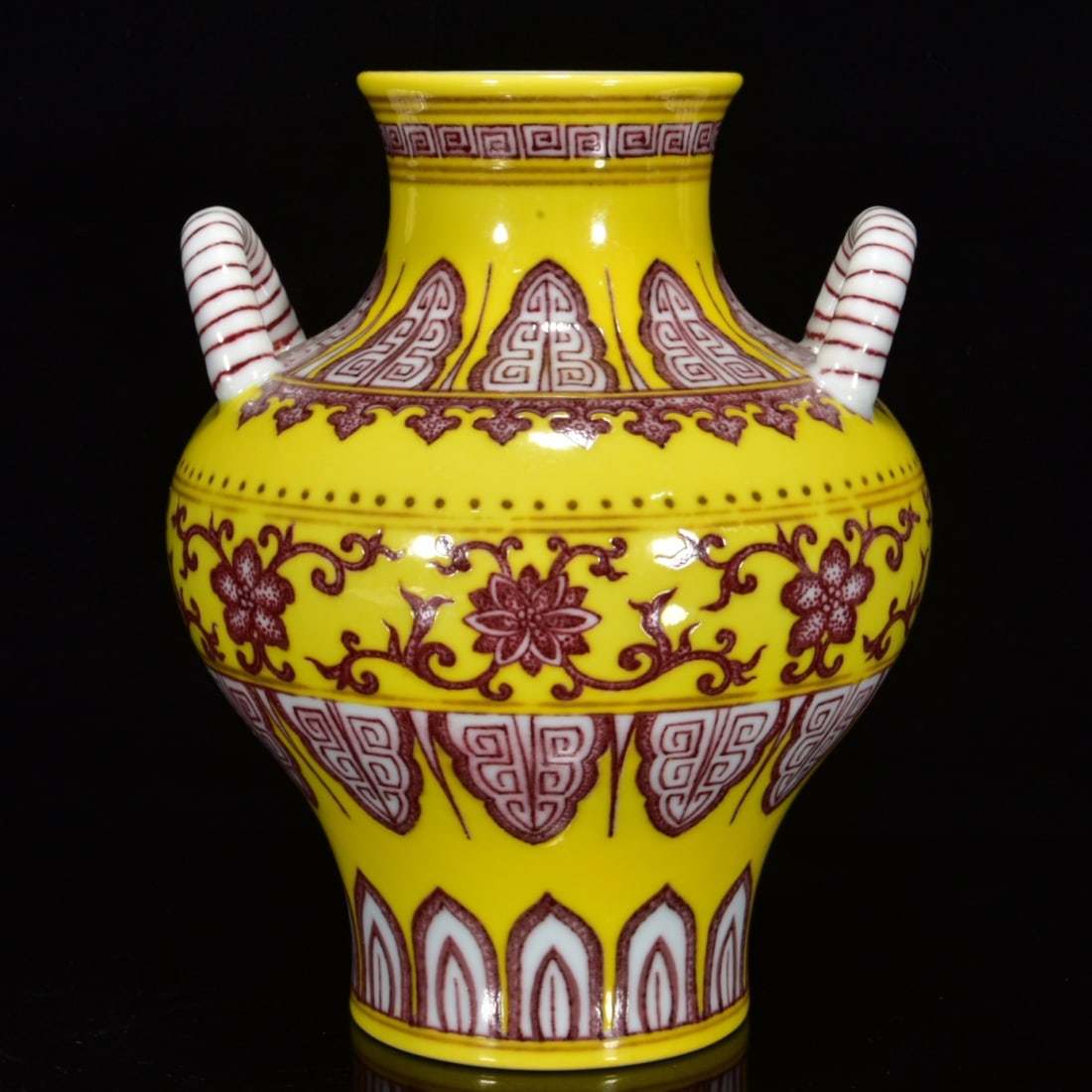 A YELLOW-GLAZED UNDERGLAZED RED 'INTERLOCKING LOTUS' DOUBLE-LUG VASE: A YELLOW-GLAZED UNDERGLAZED RED 'INTERLOCKING LOTUS' DOUBLE-LUG VASE Dimensions: Length: 20 cm (7.87 in.), Width: 16 cm (6.30 in.). All measurements are approximate.