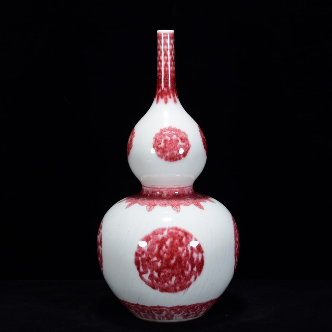 A UNDERGLAZED RED 'FORTUNE AND LONGEVITY' GOURD: A UNDERGLAZED RED 'FORTUNE AND LONGEVITY' GOURD Dimensions: Length: 31 cm (12.20 in.), Width: 15 cm (5.91 in.). All measurements are approximate.