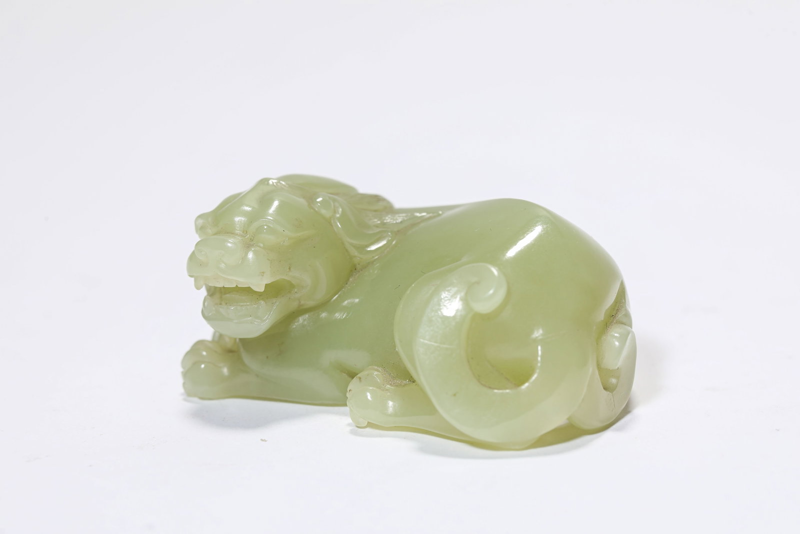 A JADE CARVED PIXIU: A JADE CARVED PIXIU Dimensions: Length: 5.5 cm (2.17 in.), Width: 3.7 cm (1.46 in.), Height: 2.7 cm (1.06 in.). All measurements are approximate.