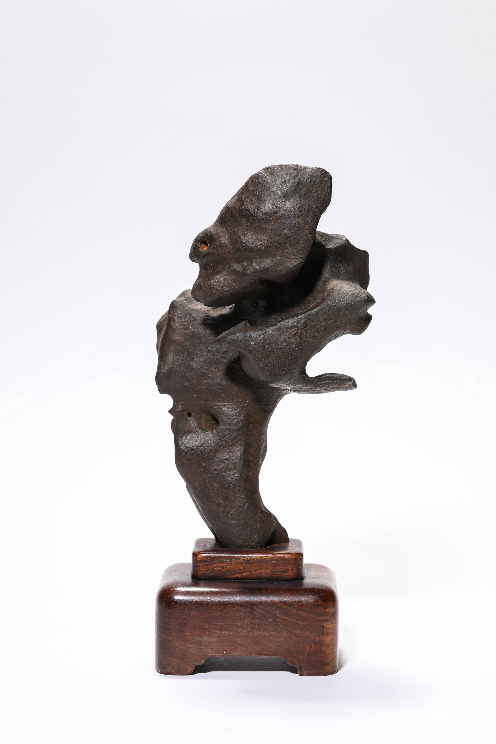 A LINGBI STONE MOUNTAIN-FORM ORNAMENT: A LINGBI STONE MOUNTAIN-FORM ORNAMENT Dimensions: Length: 10.5 cm (4.13 in.), Width: 6.9 cm (2.72 in.), Height: 24.6 cm (9.69 in.). All measurements are approximate.