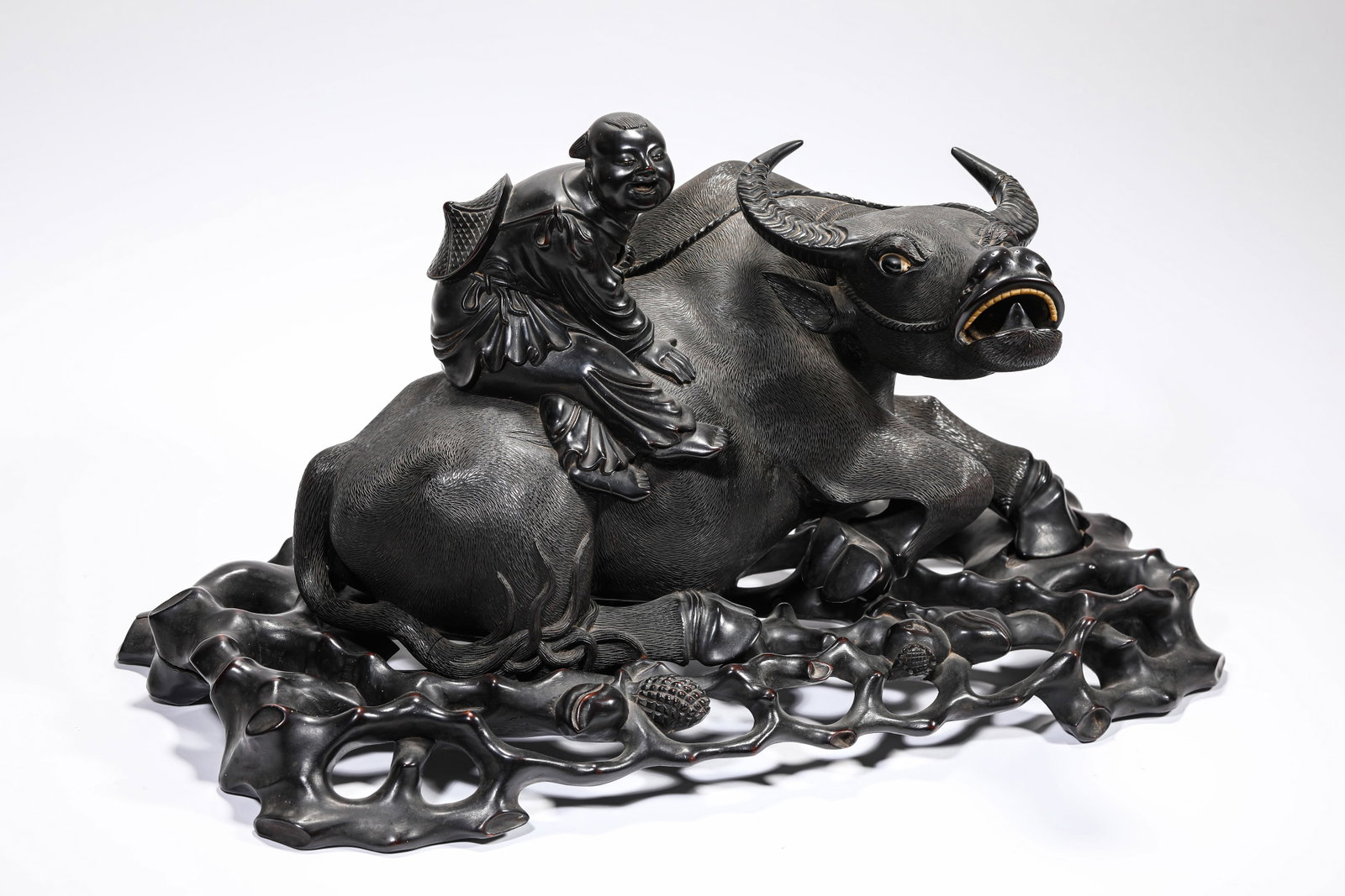 A WOOD CARVED 'BOY HERDING BUFFALO' ORNAMENT (1 of 10)