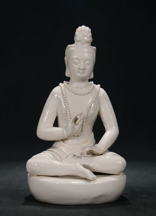 A DEHUA WHITE-GLAZED 'HE CHAOZONG' MARK SEATED BODHISATTVA WITH CROWN (1 of 9)