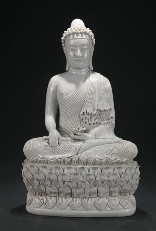 A DEHUA YINGQING GLAZED 'HE CHAOZONG' MARK SAKYAMUNI ENLIGHTENMENT FIGURE (1 of 9)