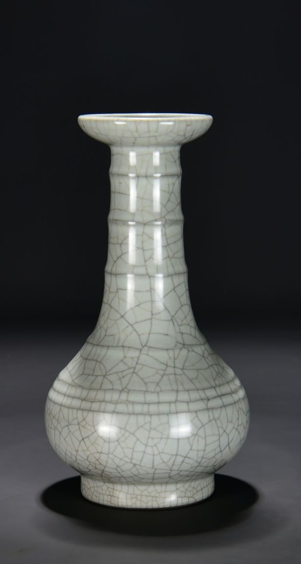 A QINGBAI GLAZED LONG-NECK STRING-PATTERN VASE (1 of 9)