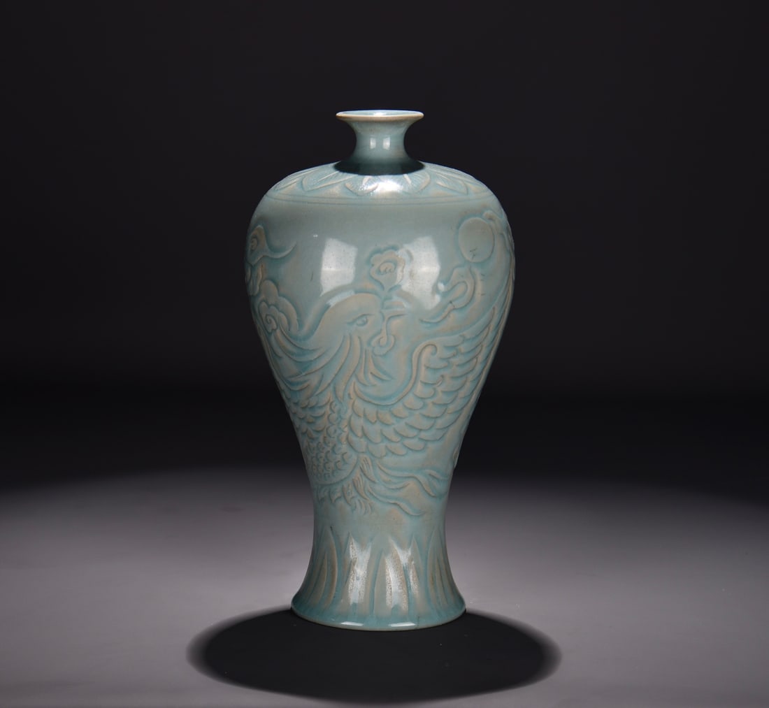 A RU TYPE SKY-BLUE GLAZED CARVED 'PHOENIX' MEIPING: A RU TYPE SKY-BLUE GLAZED CARVED 'PHOENIX' MEIPING Dimensions: Length: 28 cm (11.02 in.), Width: 15.5 cm (6.10 in.). All measurements are approximate.