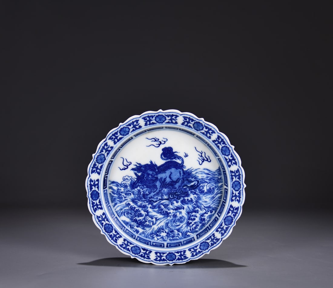 A BLUE AND WHITE 'WAVES AND AUSPICIOUS BEASTS' LOBED DISH (1 of 10)