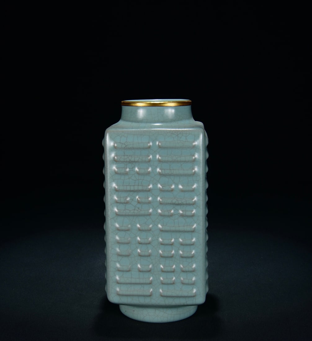 A RU TYPE SKY-BLUE GLAZED GOLD-MOUTH 'EIGHT TRIGRAMS' CONG-FORM VASE: A RU TYPE SKY-BLUE GLAZED GOLD-MOUTH 'EIGHT TRIGRAMS' CONG-FORM VASE Dimensions: Length: 21.5 cm (8.46 in.), Width: 10 cm (3.94 in.). All measurements are approximate.