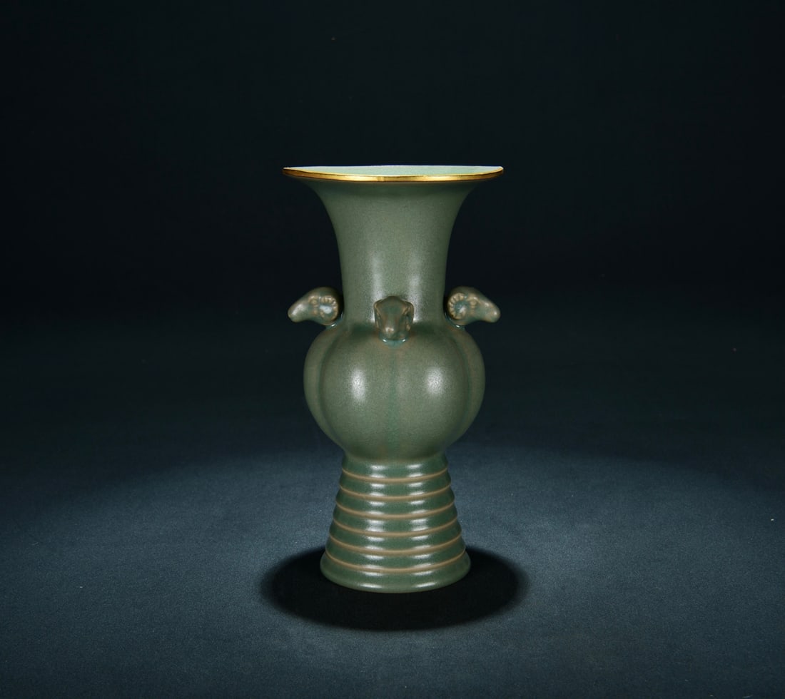 A RU TYPE SKY-BLUE GLAZED GOLD-MOUTH FOUR-RAM JAR: A RU TYPE SKY-BLUE GLAZED GOLD-MOUTH FOUR-RAM JAR Dimensions: Length: 23 cm (9.06 in.), Width: 12.5 cm (4.92 in.). All measurements are approximate.