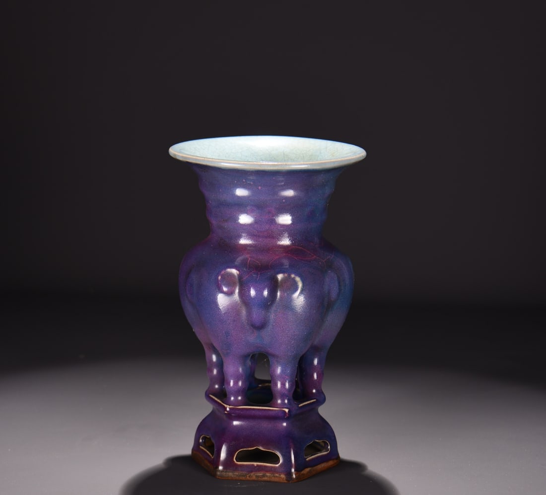 A JUN TYPE GRAPE-PURPLE RED GLAZED THREE-RAM JAR: A JUN TYPE GRAPE-PURPLE RED GLAZED THREE-RAM JAR Dimensions: Length: 26 cm (10.24 in.), Width: 16 cm (6.30 in.). All measurements are approximate.