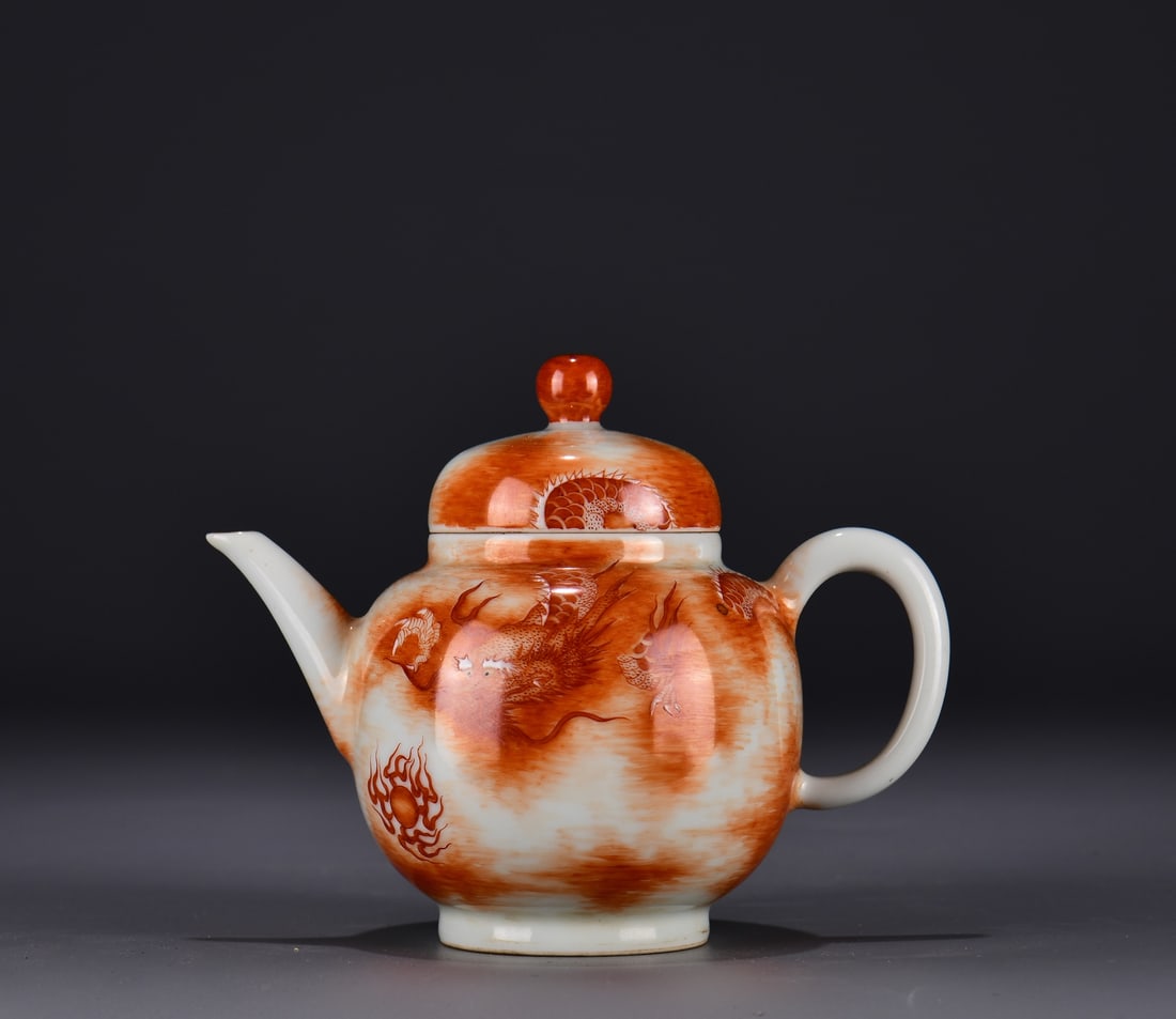 AN IRON-RED 'DRAGON' TEAPOT: AN IRON-RED 'DRAGON' TEAPOT Dimensions: Length: 11.5 cm (4.53 in.), Width: 14 cm (5.51 in.). All measurements are approximate.