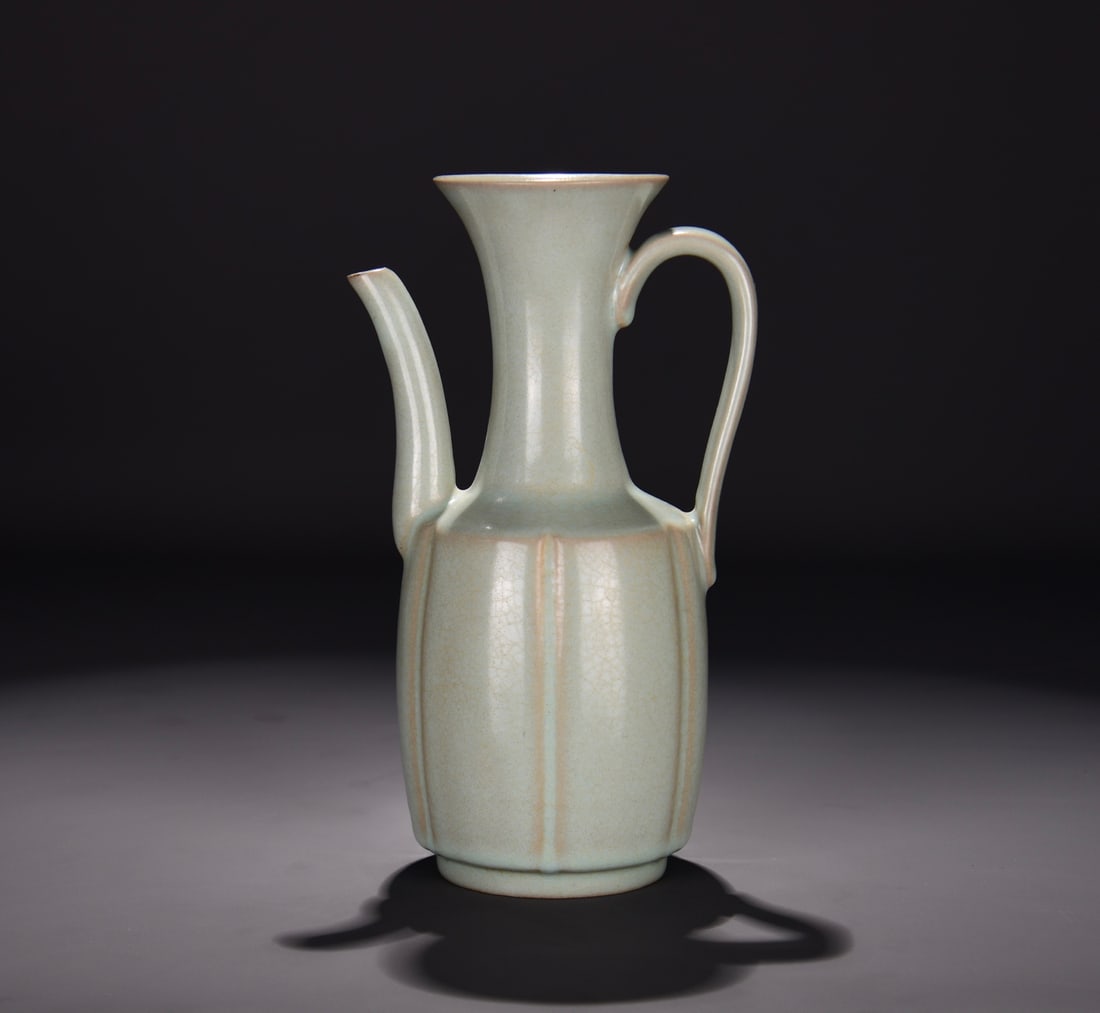 A RU TYPE SKY-BLUE GLAZED 'IMPERIAL INSCRIPTION' EWER: A RU TYPE SKY-BLUE GLAZED 'IMPERIAL INSCRIPTION' EWER Dimensions: Length: 23.5 cm (9.25 in.), Width: 14 cm (5.51 in.). All measurements are approximate.