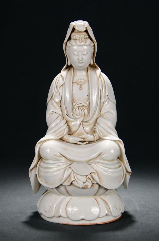 A DEHUA WHITE-GLAZED SEATED GUANYIN ON LOTUS (1 of 9)