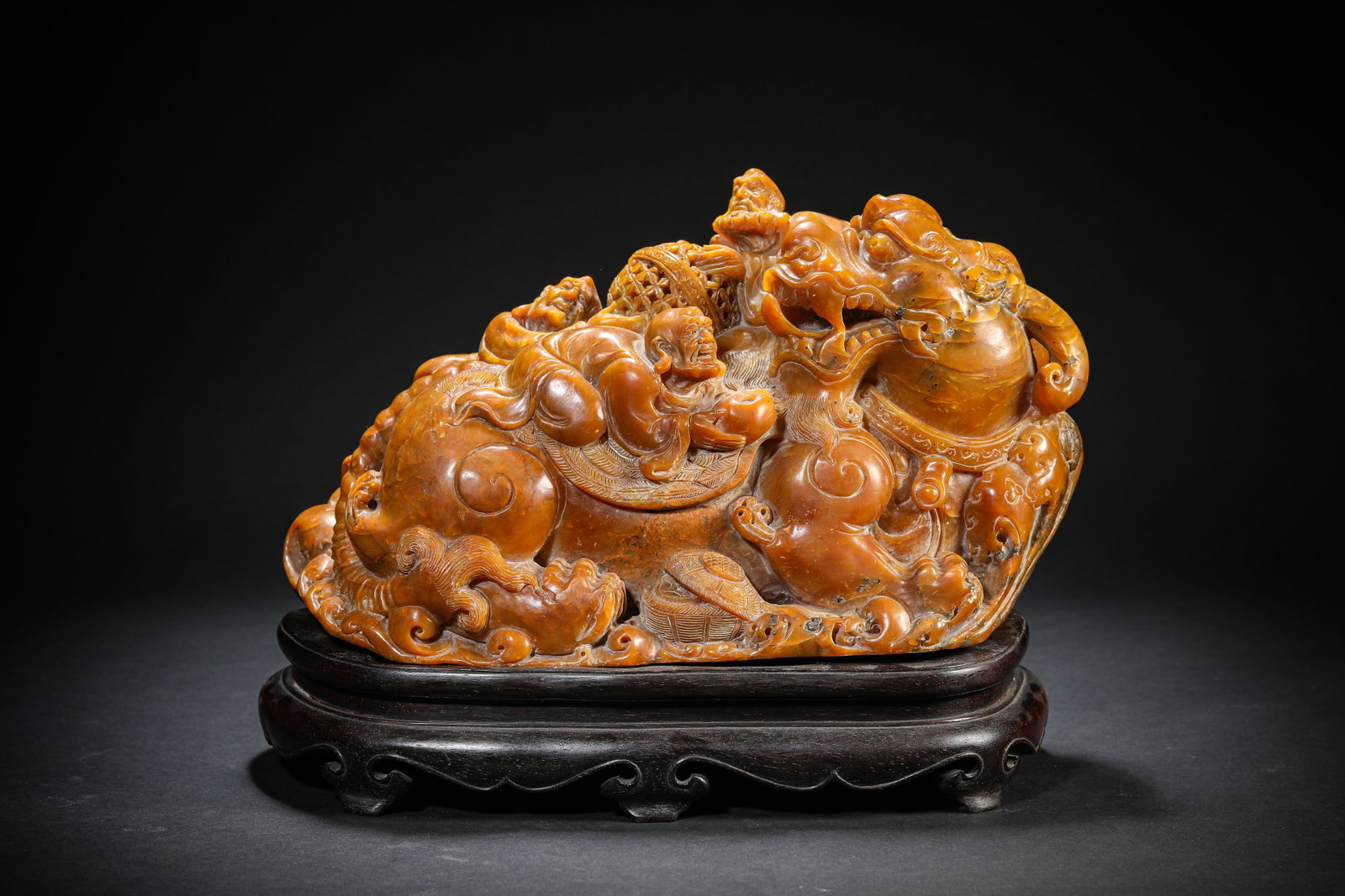 A TIANHUANG CARVED 'FIGURES AND BEASTS' MOUNTAIN ORNAMENT: A TIANHUANG CARVED 'FIGURES AND BEASTS' MOUNTAIN ORNAMENT Dimensions: Length: 25 cm (9.84 in.), Width: 10.8 cm (4.25 in.), Height: 14.5 cm (5.71 in.). All measurements are approximate.