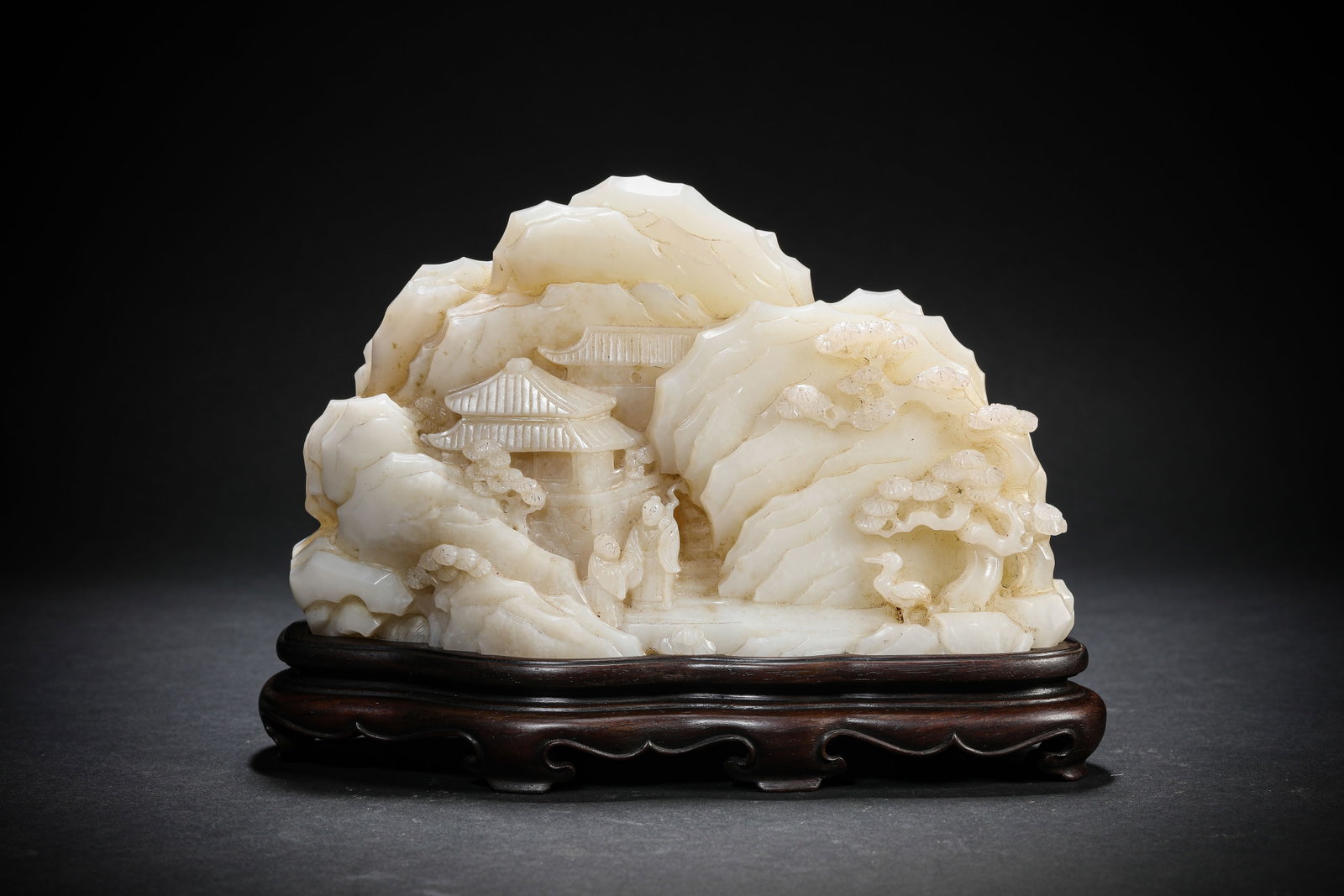 A JADE CARVED 'PINE AND CRANE FOR LONGEVITY' MOUNTAIN ORNAMENT: A JADE CARVED 'PINE AND CRANE FOR LONGEVITY' MOUNTAIN ORNAMENT Dimensions: Length: 18.1 cm (7.13 in.), Width: 5.8 cm (2.28 in.), Height: 10.9 cm (4.29 in.). All measurements are approximate.