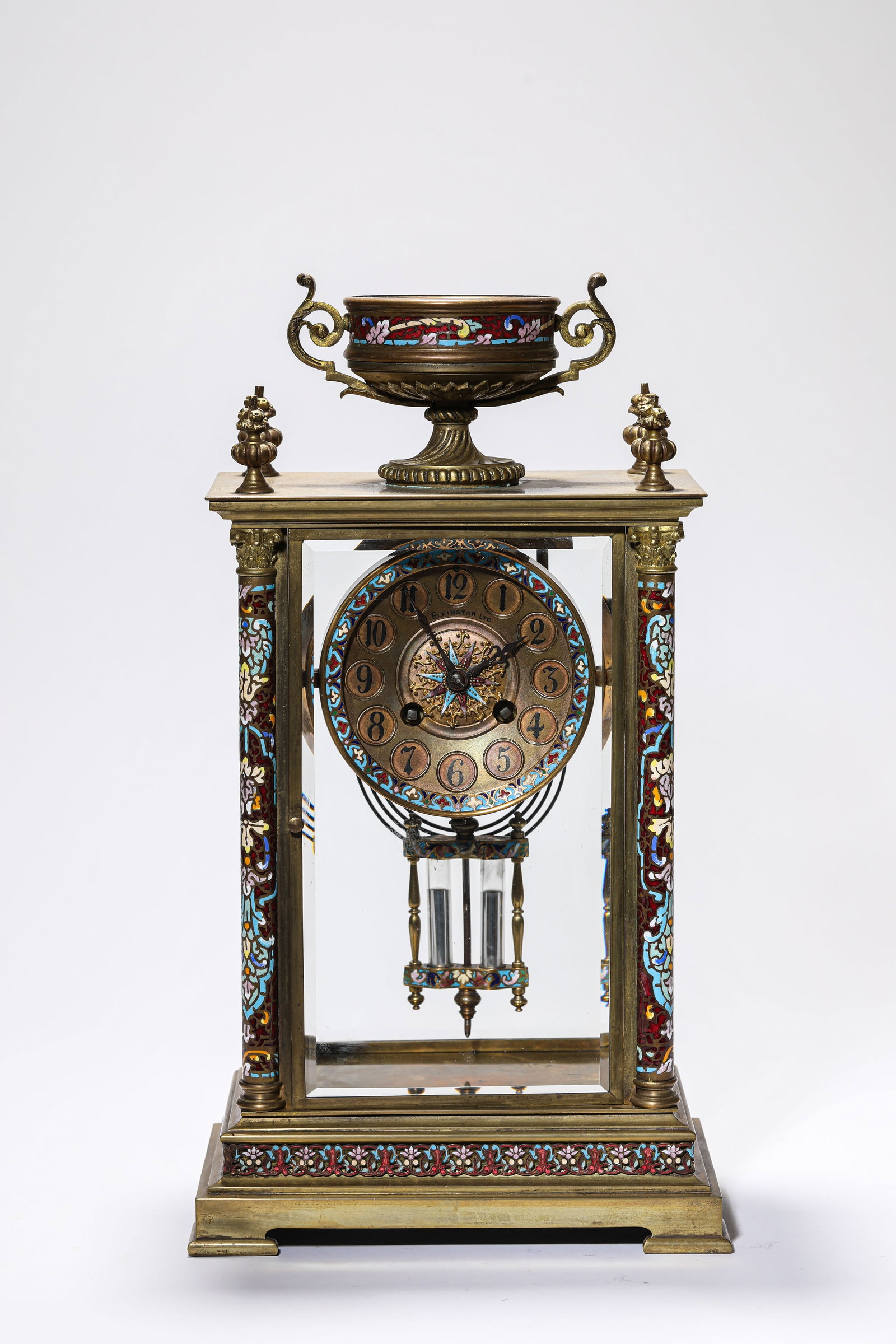 A GILT DECORATED-BRONZE AND CLOISONNE ENAMEL MANTEL CLOCK: A GILT DECORATED-BRONZE AND CLOISONNE ENAMEL MANTEL CLOCK Dimensions: Length: 21.6 cm (8.50 in.), Width: 12.9 cm (5.08 in.), Height: 39 cm (15.35 in.). Weight: 6 kg. All measurements are approximate.