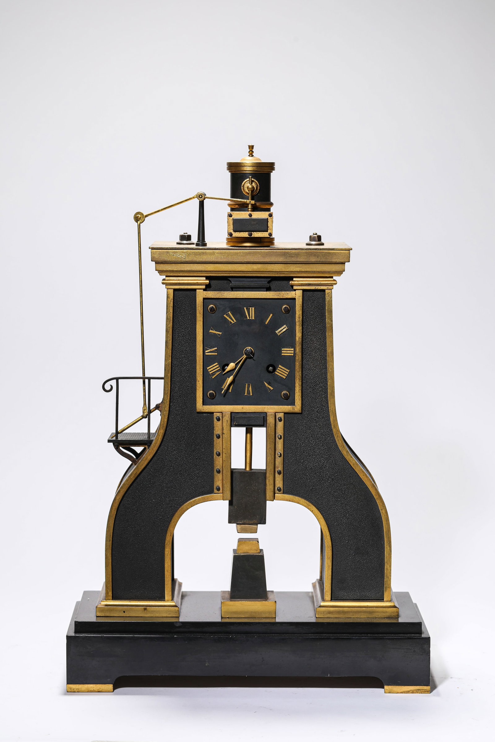 A GILT DECORATED-BRONZE AUTOMATON CLOCK: A GILT DECORATED-BRONZE AUTOMATON CLOCK Dimensions: Length: 30.6 cm (12.05 in.), Width: 14 cm (5.51 in.), Height: 46 cm (18.11 in.). Weight: 8.4 kg. All measurements are approximate.