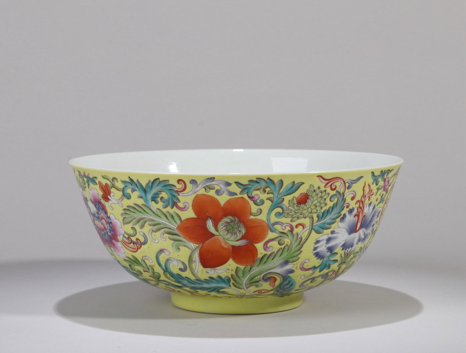 A YELLOW-GROUND FAMILLE ROSE 'FLOWERS' BOWL: A YELLOW-GROUND FAMILLE ROSE 'FLOWERS' BOWL Dimensions: Length: 18 cm (7.09 in.), Width: 18 cm (7.09 in.), Height: 7.6 cm (2.99 in.). All measurements are approximate.