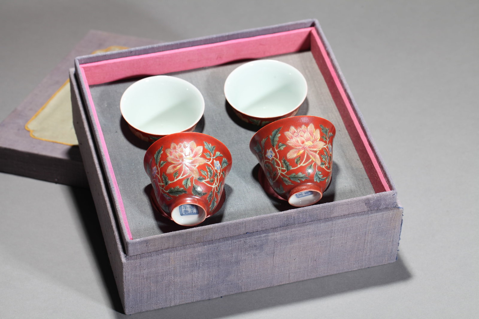 FOUR IRON-RED AND FAMILLE ROSE 'FLOWERS' CUPS: FOUR IRON-RED AND FAMILLE ROSE 'FLOWERS' CUPS Dimensions: Length: 6.5 cm (2.56 in.), Width: 6.5 cm (2.56 in.), Height: 5 cm (1.97 in.). All measurements are approximate.