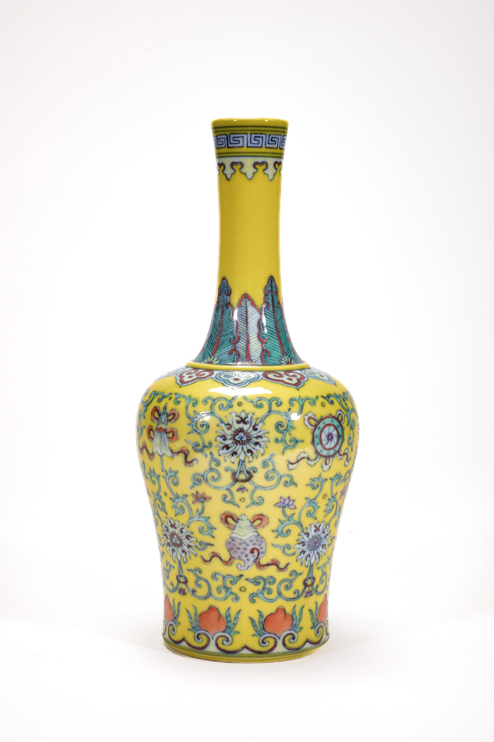 A YELLOW-GROUND DOUCAI 'INTERLOCKING FLOWERS AND EIGHT TREASURES' BELL-SHAPED ZUN
