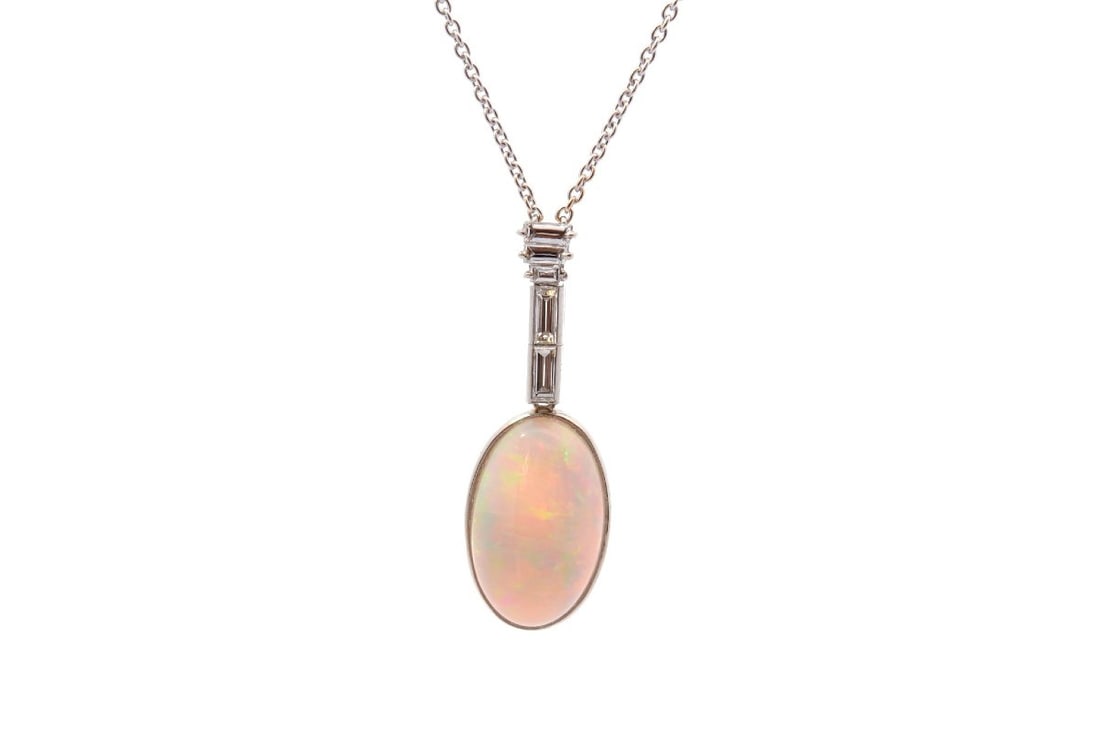 OPAL NECKLACE OF 6,11CTS AND DIAMONDS: OPAL NECKLACE OF 6,11CTS AND DIAMONDS Description: Stones: opal of 6,11cts and diamonds: 0,30ct Material: platinum and 18k gold Weight:6,5g Dimensions: chain: 40cm, pendant: 3,4cm Period: recent