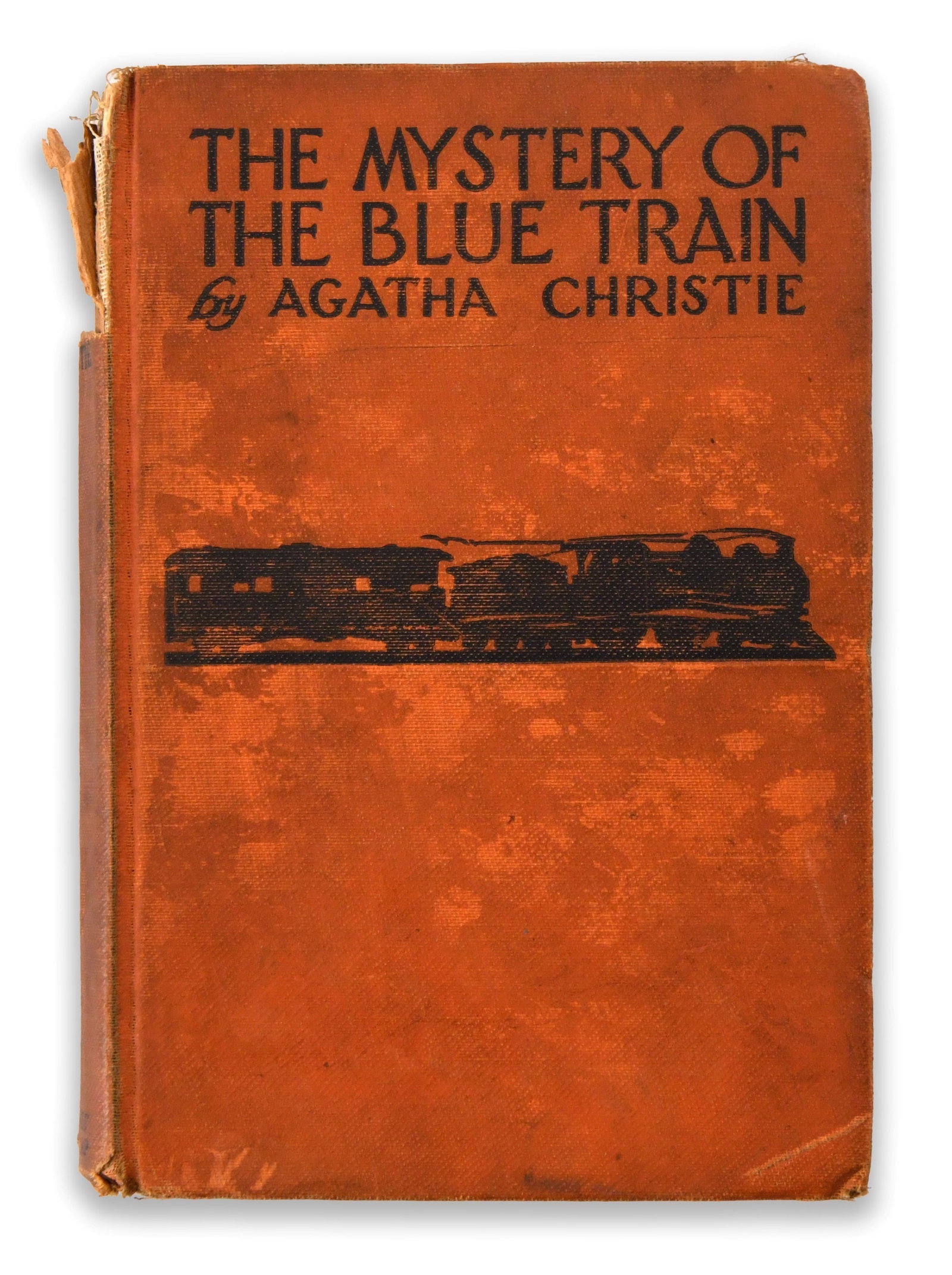 AGATHA CHRISTIE - SIGNED THE MYSTERY OF THE BLUE TRAIN (GROSSET & DUNLAP, NEW YORK EDITION): AGATHA CHRISTIE - SIGNED THE MYSTERY OF THE BLUE TRAIN (GROSSET & DUNLAP, NEW YORK EDITION) Signature: Agatha Christie Description: The volume is bound in a textured orange cloth binding featuring bol