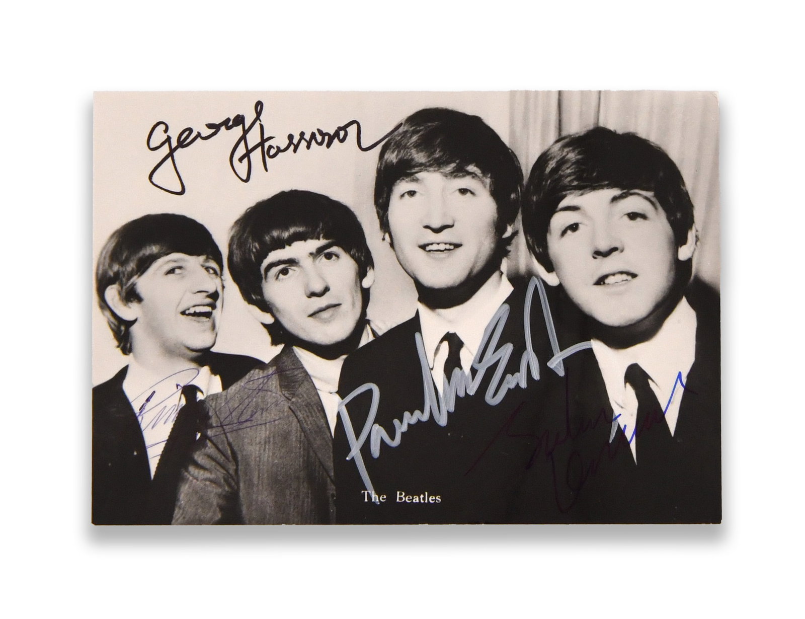 THE BEATLES - SIGNED PHOTOGRAPHIC POSTCARD: THE BEATLES - SIGNED PHOTOGRAPHIC POSTCARD Signature: John Lennon, Paul McCartney, George Harrison and Ringo Starr. Description: The lot titled The Beatles - Signed Photographic Postcard is described 