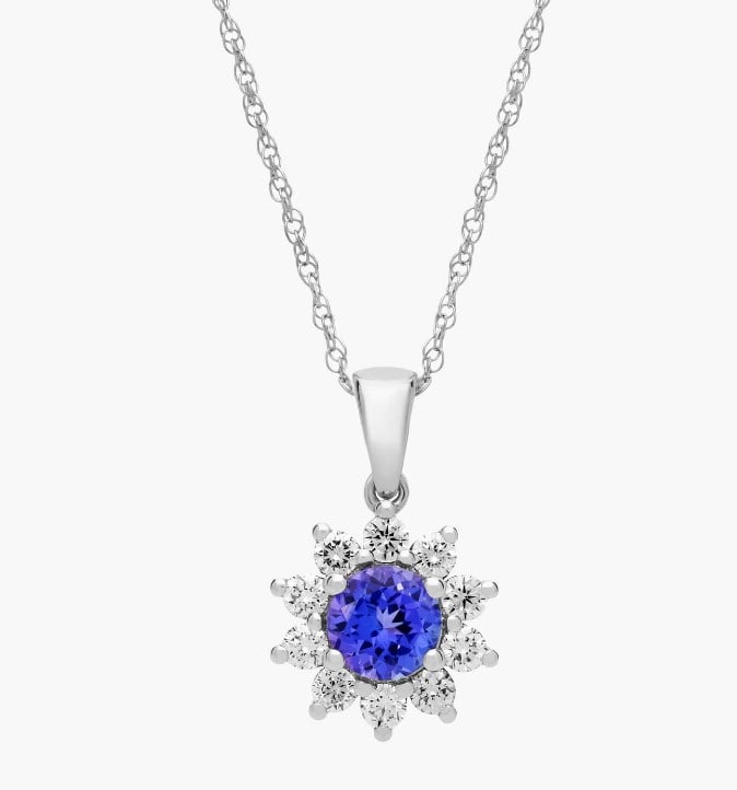 ROUND TANZANITE AND DIAMOND HALO PENDANT NECKLACE IN 14K WHITE GOLD (6MM): ROUND TANZANITE AND DIAMOND HALO PENDANT NECKLACE IN 14K WHITE GOLD (6MM) Description: A stylish round tanzanite gets added sparkle from a halo of diamonds in this 14k gold necklace. Add some color to