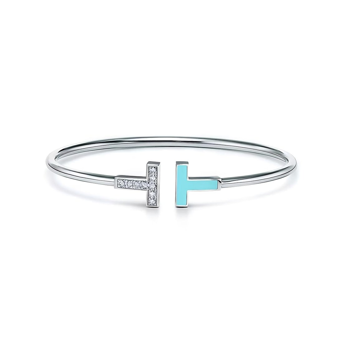 TIFFANY-STYLE T MOTIF DIAMOND AND TURQUOISE ENAMEL BANGLE: TIFFANY-STYLE T MOTIF DIAMOND AND TURQUOISE ENAMEL BANGLE Description: The lot consists of a slender open bangle bracelet crafted in white metal and designed with the iconic "T" motif at the center; o