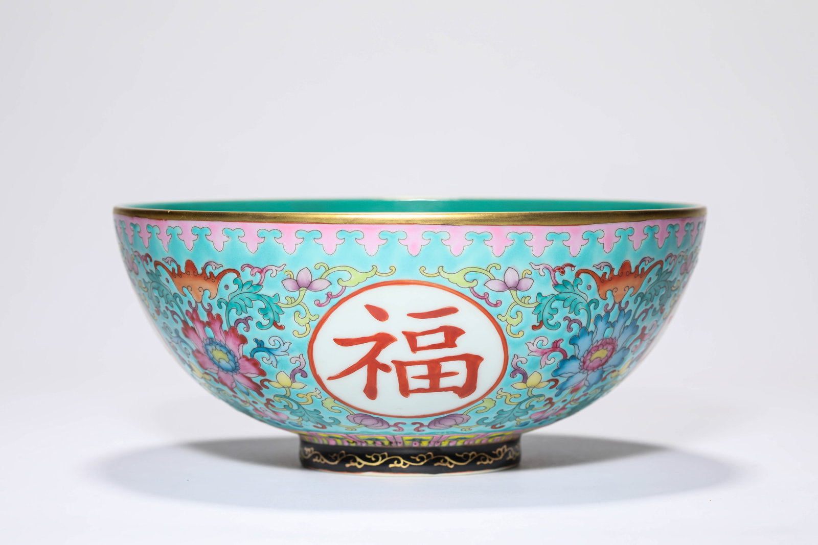 A TURQUOISE GREEN-GROUND FAMILLE ROSE 'AUSPICIOUS CHARACTERS' BOWL: A TURQUOISE GREEN-GROUND FAMILLE ROSE 'AUSPICIOUS CHARACTERS' BOWL Dimensions: Width: 20.8 cm (8.19 in.), Height: 9.2 cm (3.62 in.). All measurements are approximate.