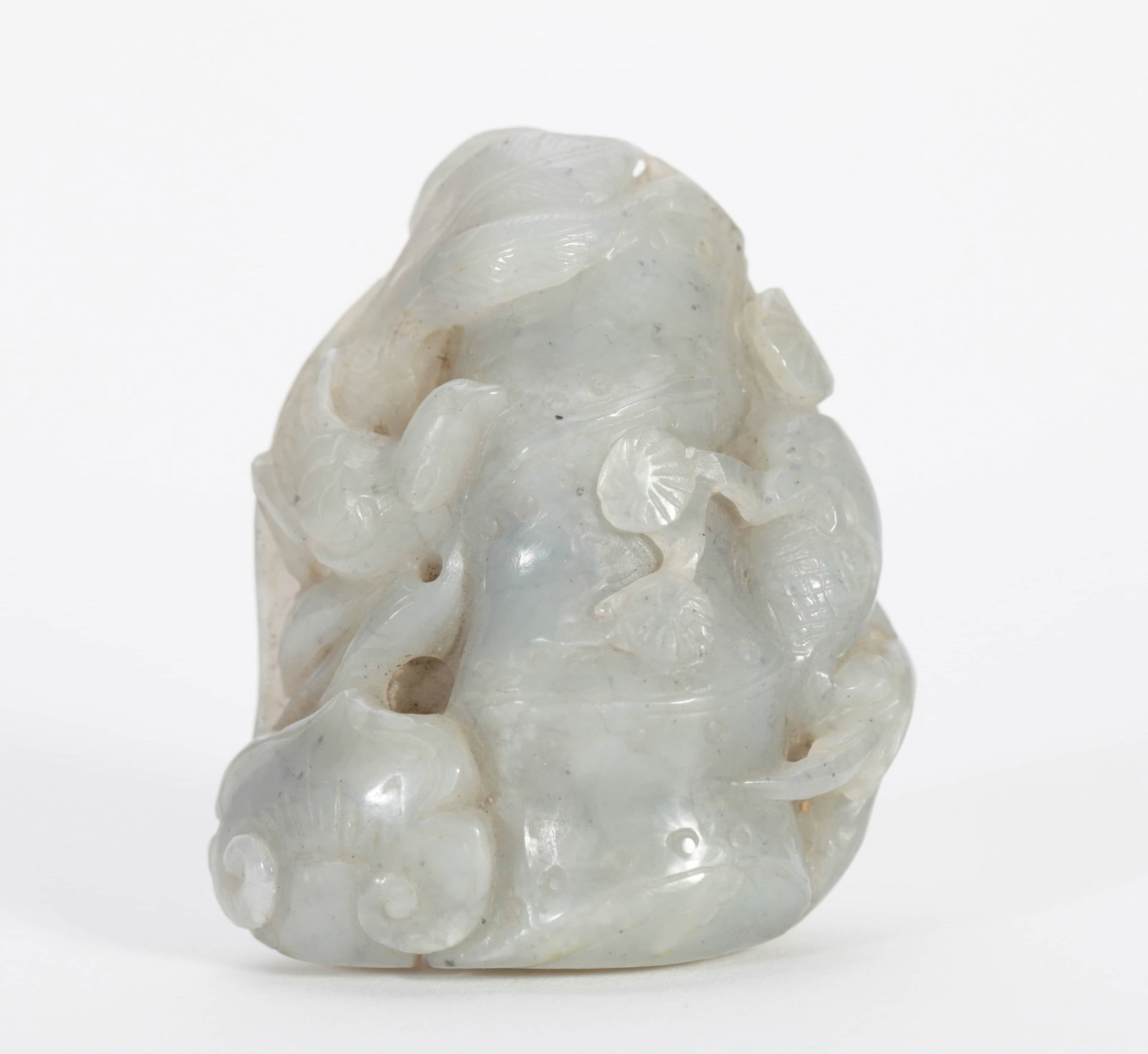A JADE OBJECT: A JADE OBJECT Dimensions: Height: 6 cm (2.36 in.). All measurements are approximate.