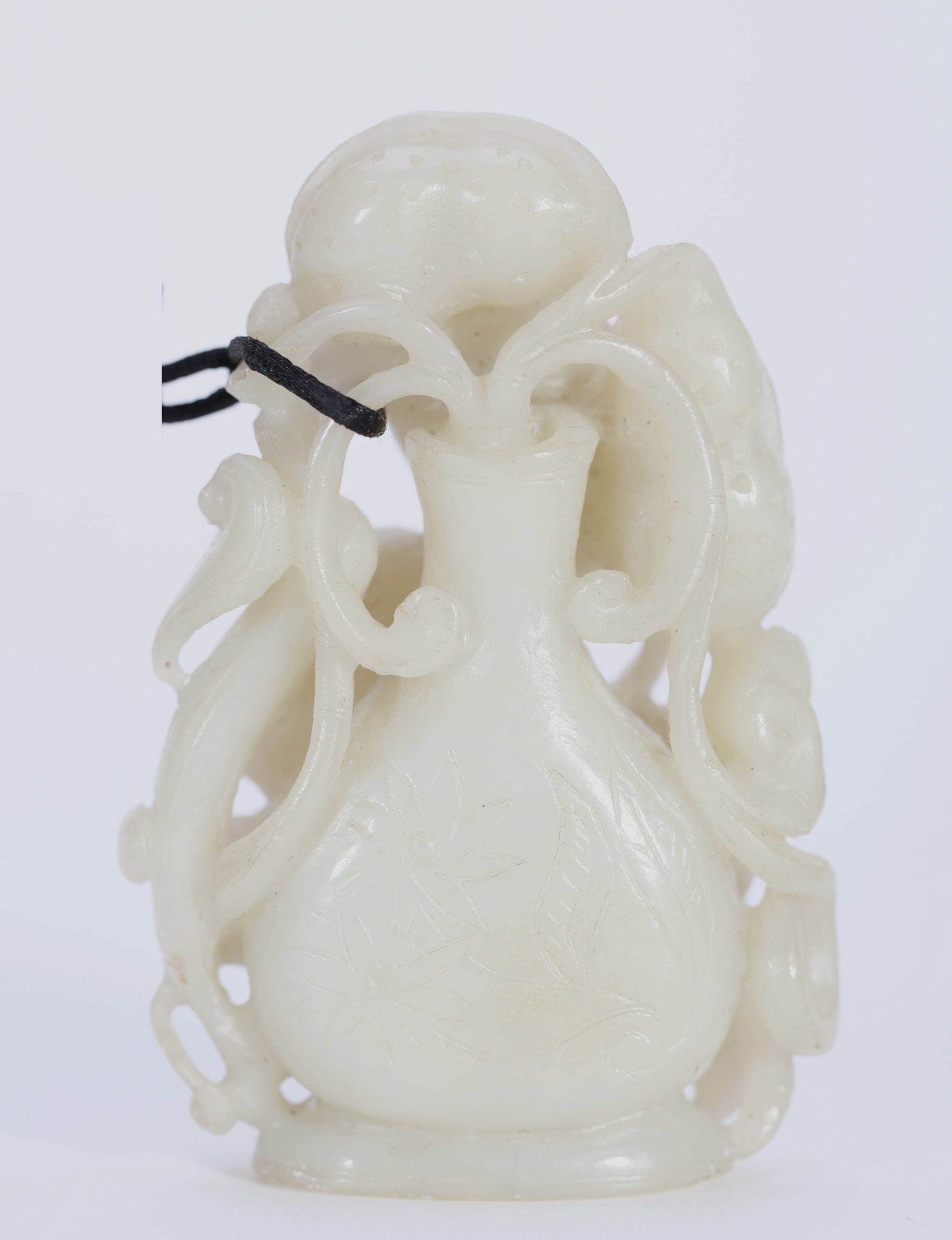 A JADE OBJECT: A JADE OBJECT Dimensions: Height: 6.5 cm (2.56 in.). All measurements are approximate.