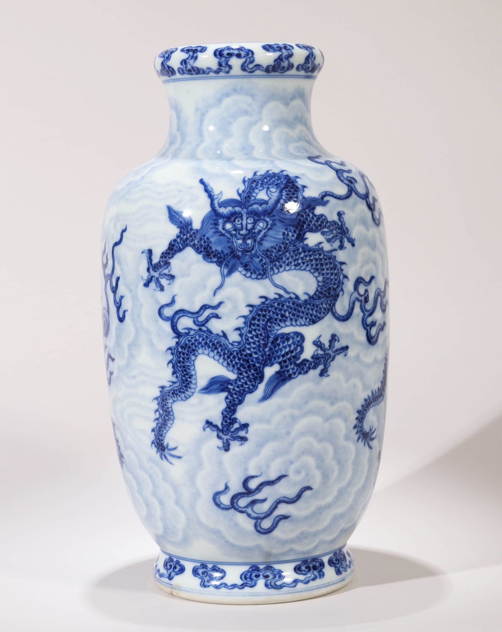 A BLUE AND WHITE 'WAVES AND DRAGON' DISH-MOUTH VASE: A BLUE AND WHITE 'WAVES AND DRAGON' DISH-MOUTH VASE Dimensions: Height: 31 cm (12.20 in.). All measurements are approximate.