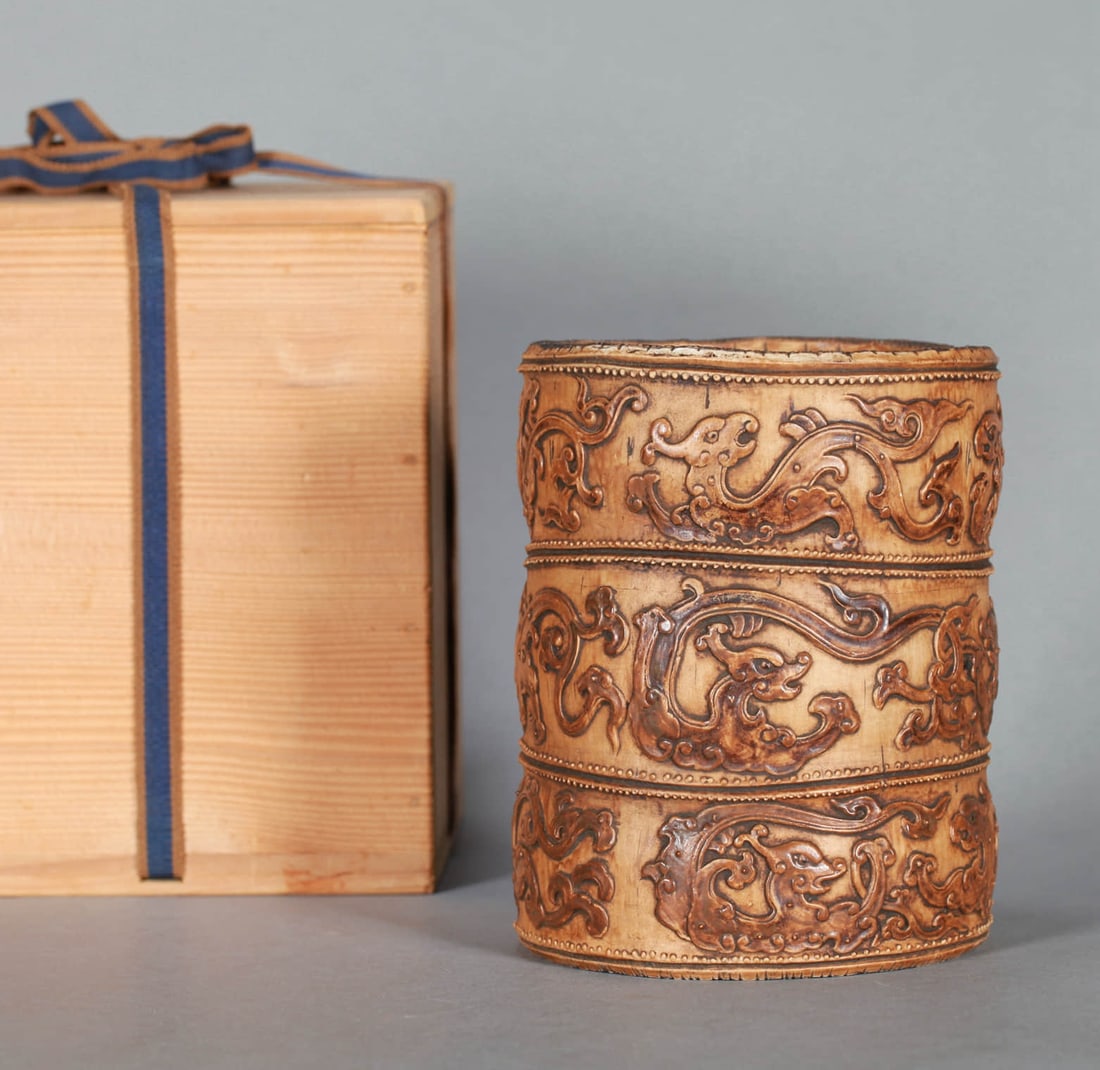 A PORCELAIN CARVED 'BAMBOO' BRUSH POT: A PORCELAIN CARVED 'BAMBOO' BRUSH POT Dimensions: Diameter: 12 cm (4.72 in.), Height: 15.5 cm (6.10 in.). All measurements are approximate.