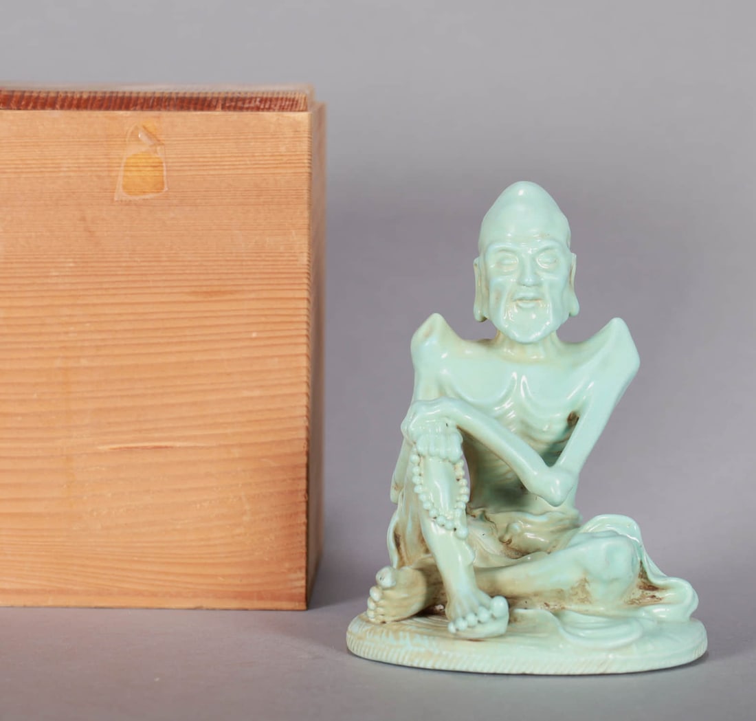 A GREEN-GLAZED 'EMACIATED LUOHAN' FIGURE (1 of 6)