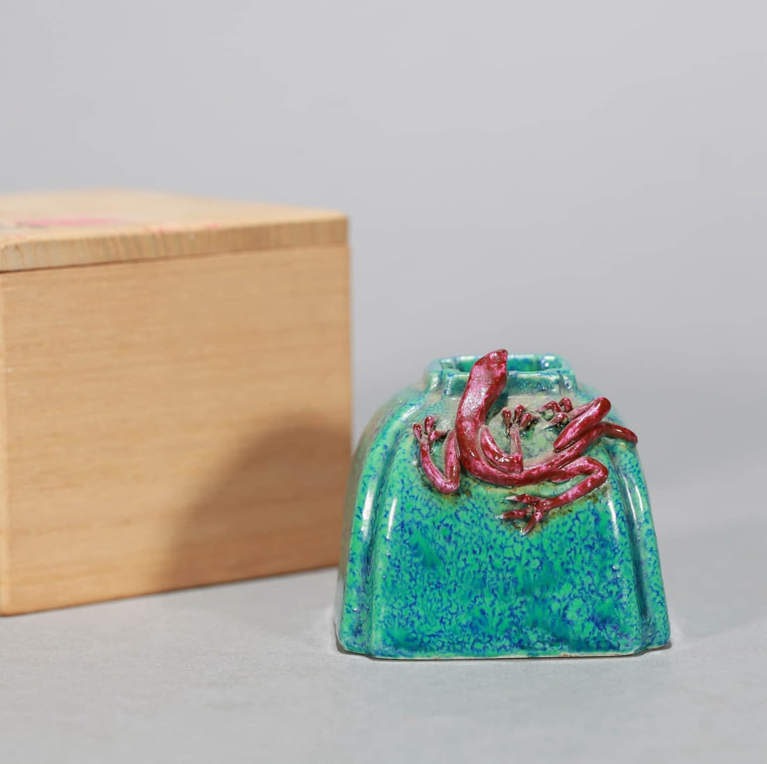 A ROBIN'S EGG GLAZED CARVED 'DRAGON' WATER POT: A ROBIN'S EGG GLAZED CARVED 'DRAGON' WATER POT Dimensions: Length: 6.3 cm (2.48 in.), Width: 6.3 cm (2.48 in.), Height: 5.2 cm (2.05 in.). All measurements are approximate.