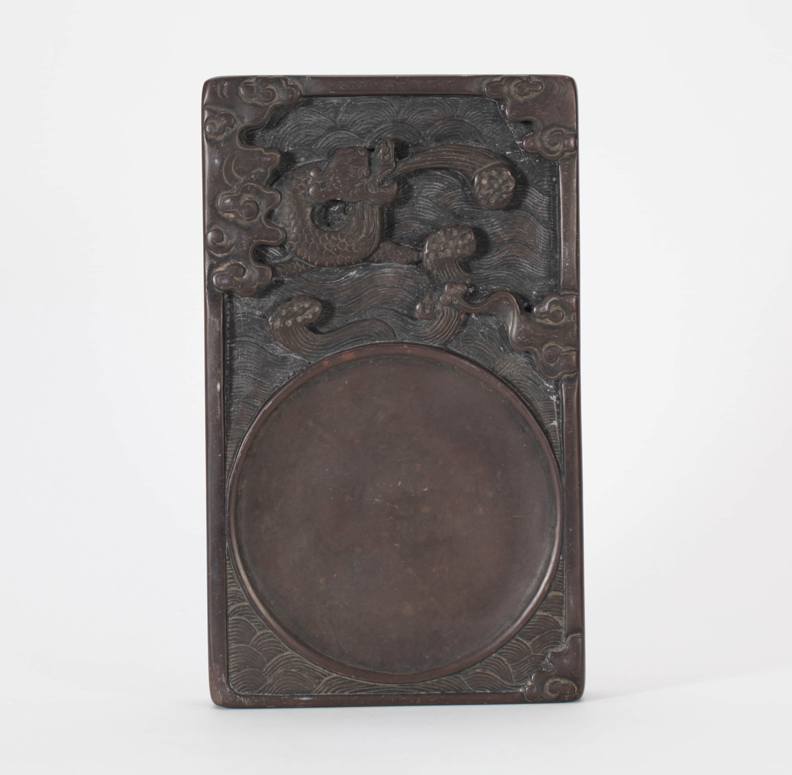 A 'DRAGON' INKSTONE: A 'DRAGON' INKSTONE Dimensions: Length: 22 cm (8.66 in.), Width: 13 cm (5.12 in.), Height: 4 cm (1.57 in.). All measurements are approximate.