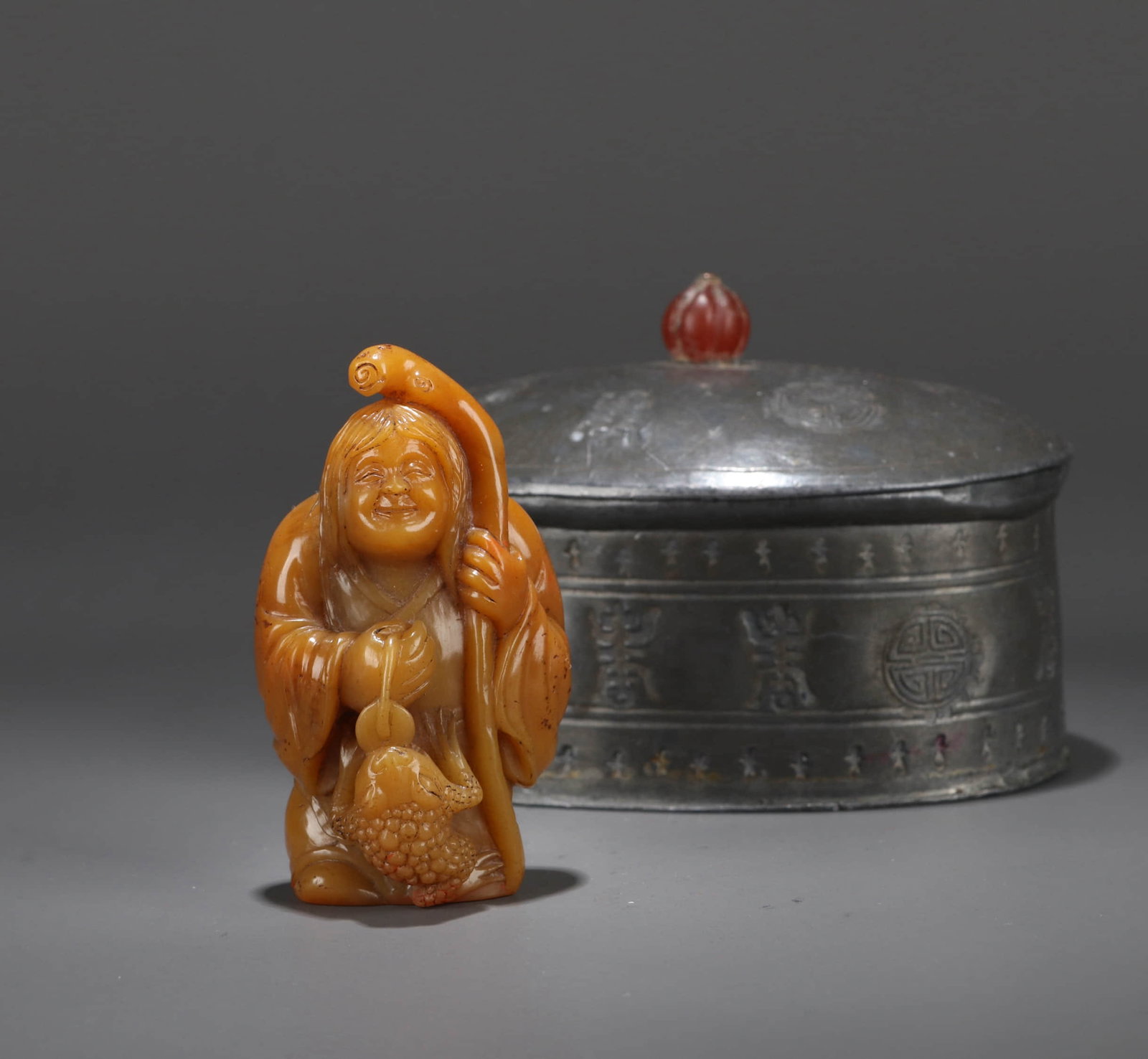 A TIANHUANG 'LIU HAI AND GOLDEN CICADA' SEAL: A TIANHUANG 'LIU HAI AND GOLDEN CICADA' SEAL Dimensions: Height: 6.5 cm (2.56 in.). Weight: 71 g. All measurements are approximate.