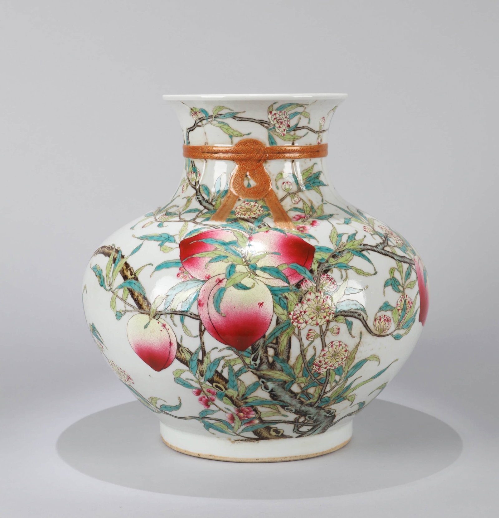 A FAMILLE ROSE 'NINE PEACHES' WRAPPED VASE: A FAMILLE ROSE 'NINE PEACHES' WRAPPED VASE Dimensions: Height: 28 cm (11.02 in.). All measurements are approximate.