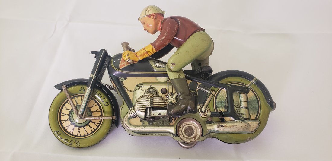 Arnold Mac 700 Tin Clockwork Toy Motorcycle US Zone Germany: Antique Arnold Mac 700 Tin Clockwork Toy Motorcycle *Missing Headlight* Made in US Zone Germany. Buyers Premium is 20%. *In-House Shipping Available*
