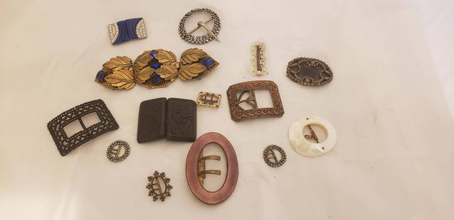 Ladies Antique Buckle Lot: Ladies Anrtique Buckle Lot. There are a few that are enamel, some metal and even a wood carved piece. Buyers Premium 20% *In-House Shipping Available* After you pay your invoice for Hammer Price