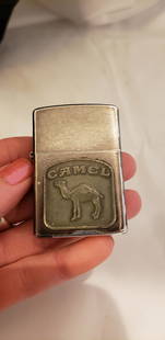 Vintage Zippo Lighter Camel: Vintage Zippo Lighter Camel. In well loved condition.Buyers Premium 20% *In-House Shipping Available* After you pay your invoice for Hammer Price and Premium YOU WILL RECEIVE A 2nd INVOICE THRU