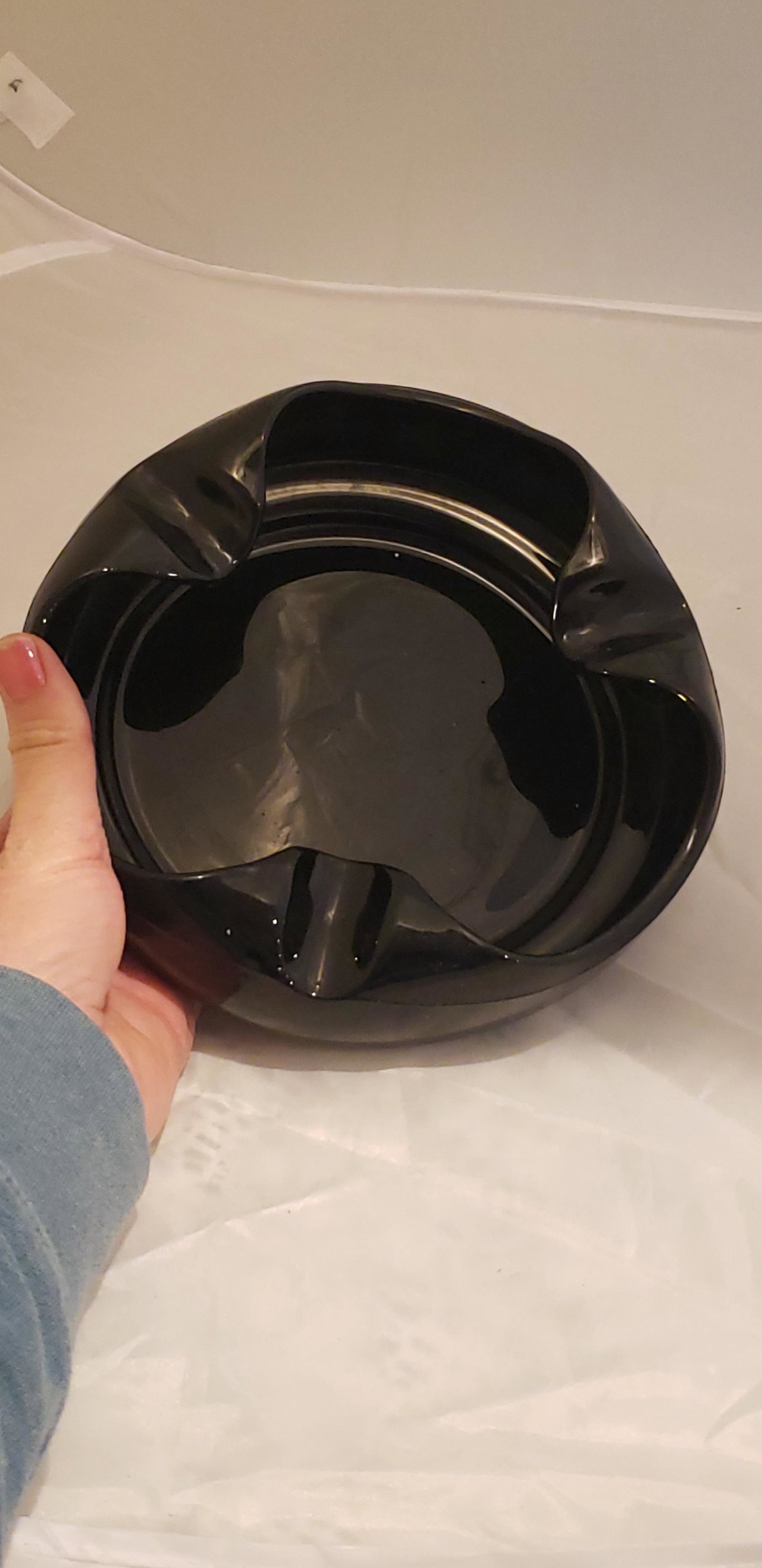 NuArt Deco Black Amethyst Glass Ashtray: NuArt Deco Black Amethyst Glass Ashtray. 7" in Diameter. Buyers Premium 20% *In-House Shipping Available* After you pay your invoice for Hammer Price and Premium YOU WILL RECEIVE A 2nd INVOICE THRU PA