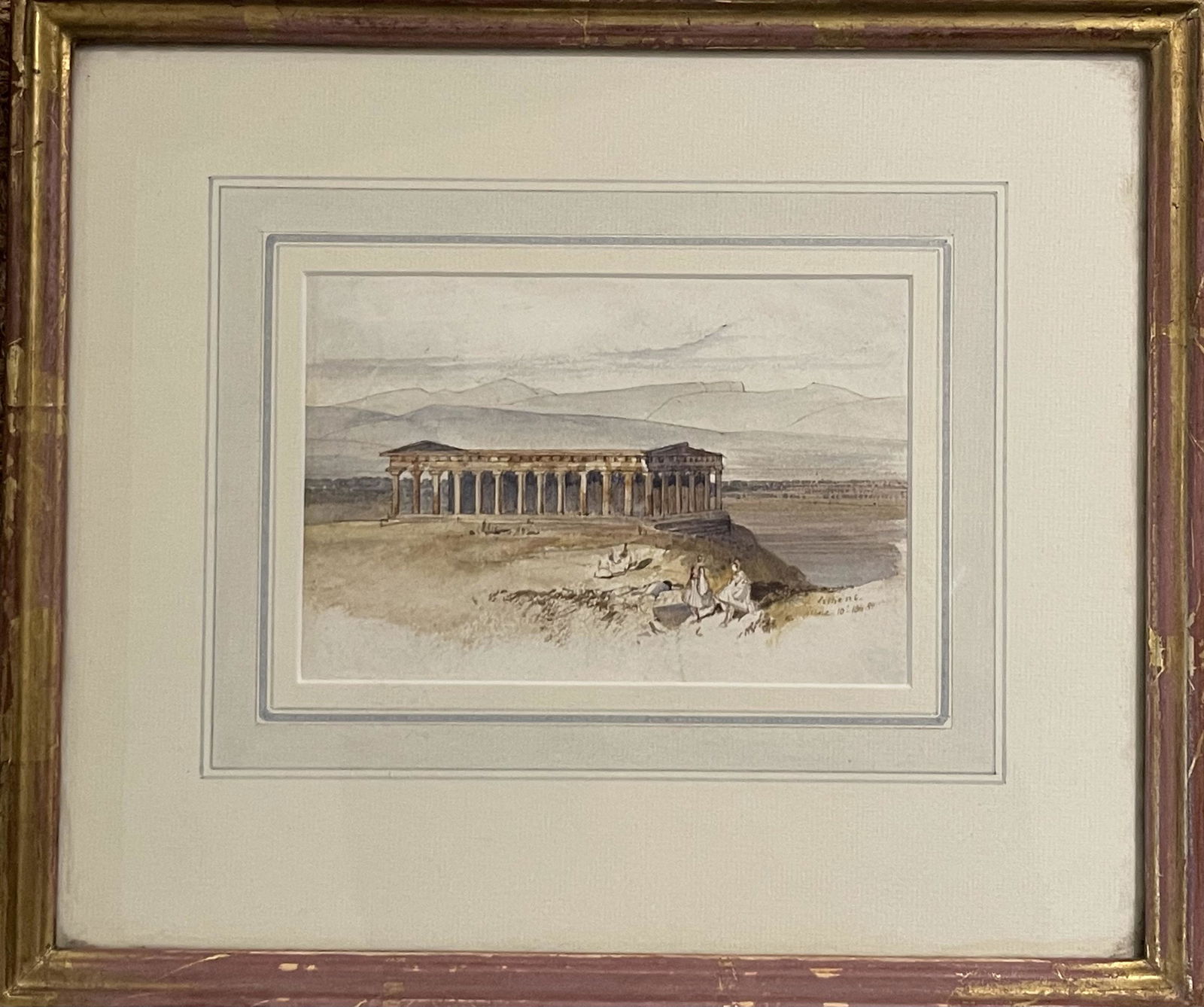 An Edward Lear Watercolour of The Hephaisteion: An Edward Lear watercolour of The Hephaisteion with seated figures in the foreground. On paper. Dated. Inscribed: "Athens / June 10th 1848". (reverse) Thomas Agnew & Sons label: "no 36717"; "no 75 E.