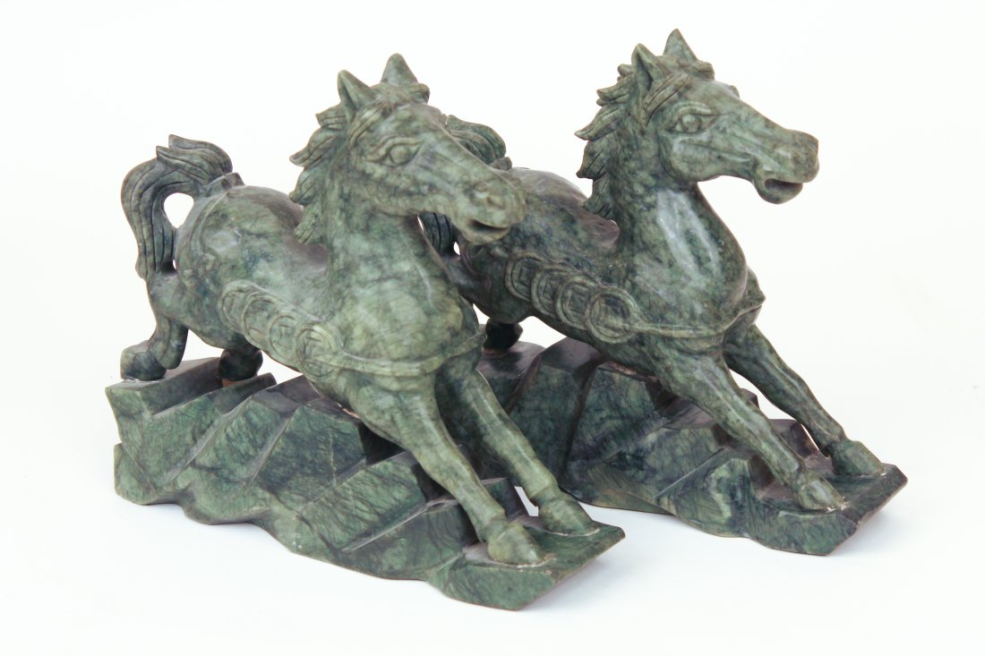 Green Carved Jadeite Horses -A Pair: A pair of Asian carved green jadeite horse bookends or sculptures. Felt pads on the bottom of each.