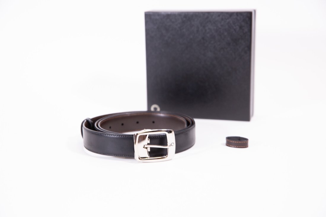 Mont Blanc Reversible Leather Belt: Mont Blanc black/brown reversible leather strap with silver tone buckle, approx 43.5". Original box and dustcover.